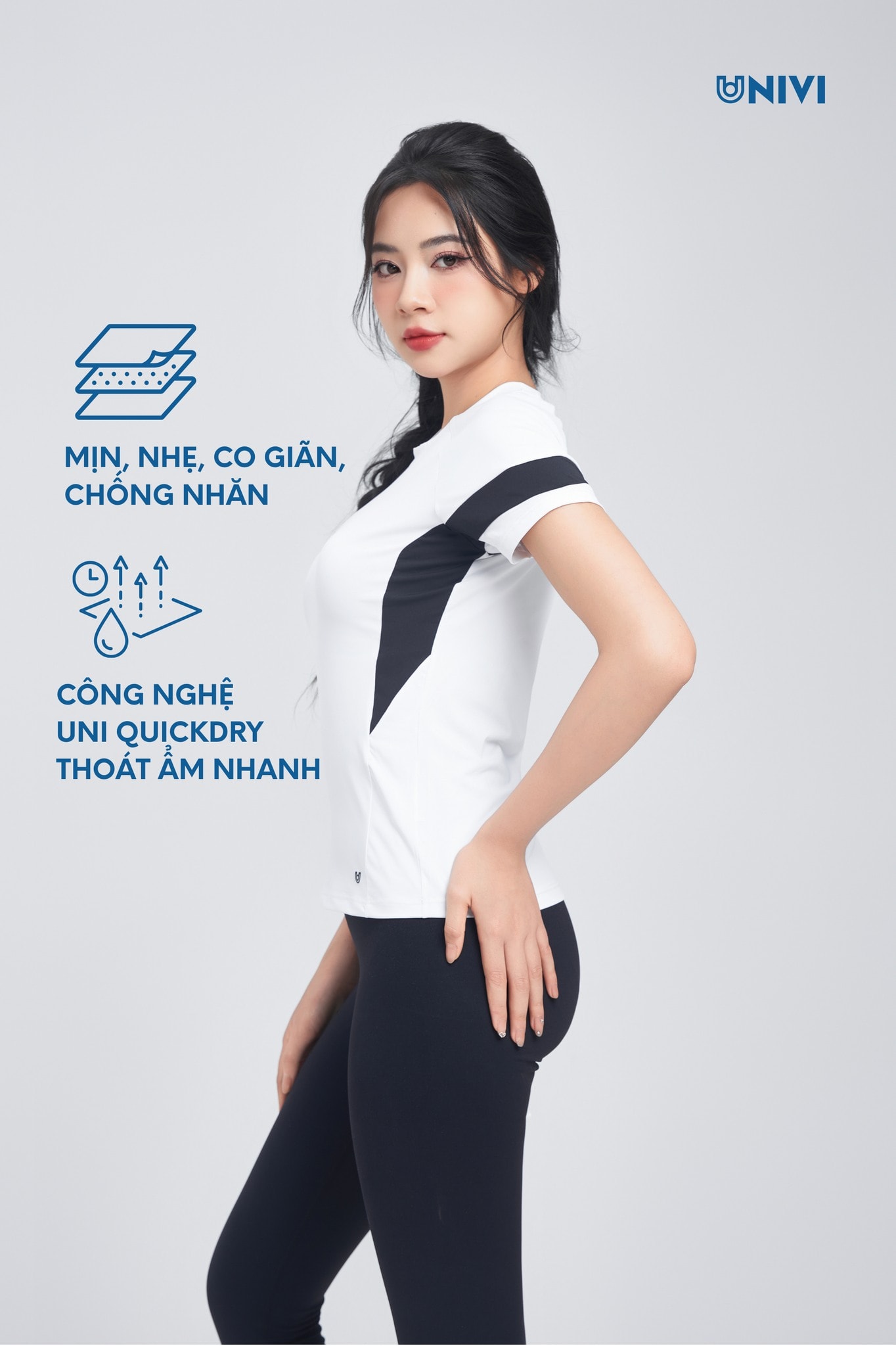 Đồng phục gym Univi nữ trắng đen, áo thấm hút mồ hôi, quần legging co giãn.
